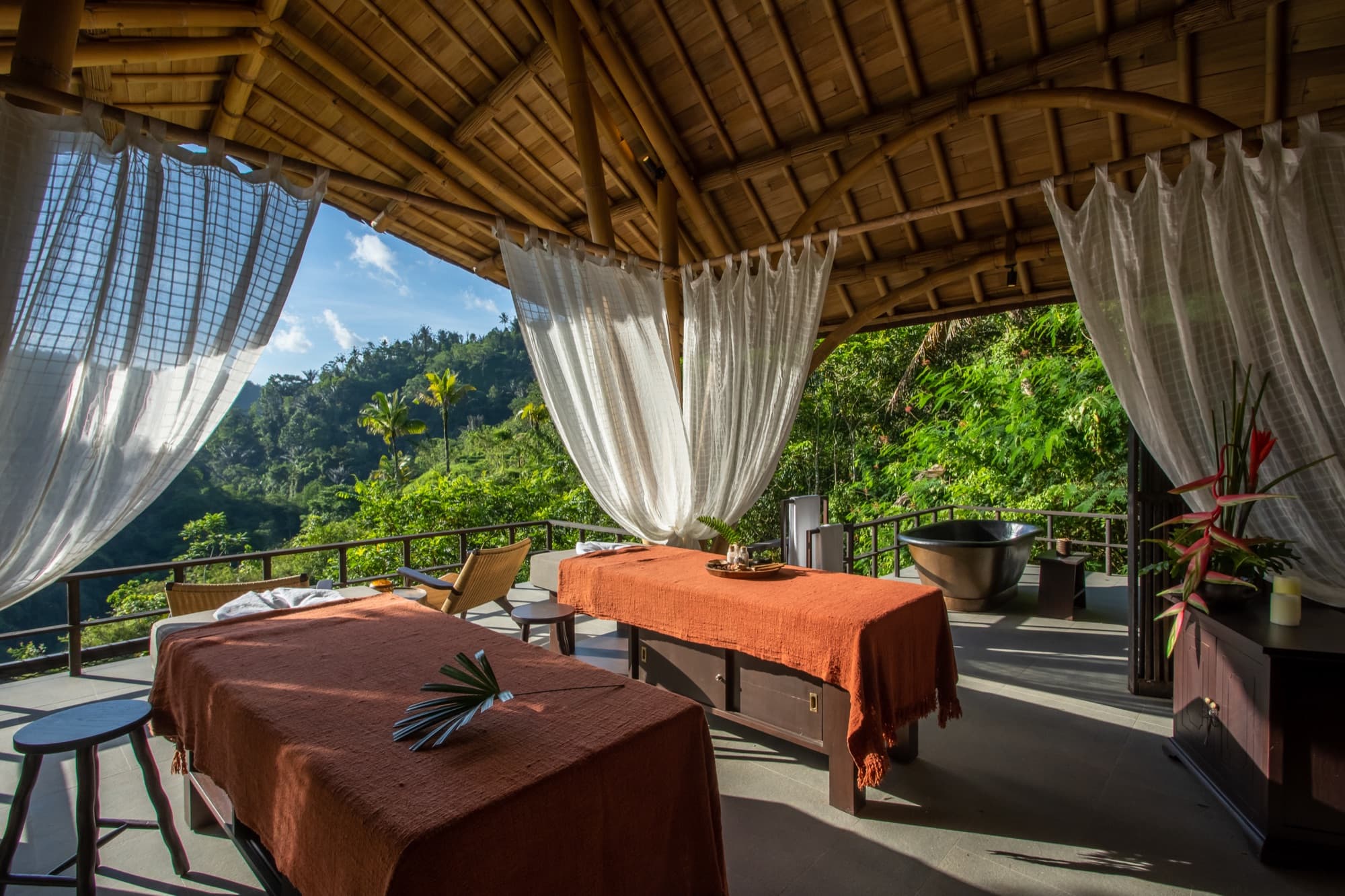 Open-air Toja Spa treatment room with jungle views